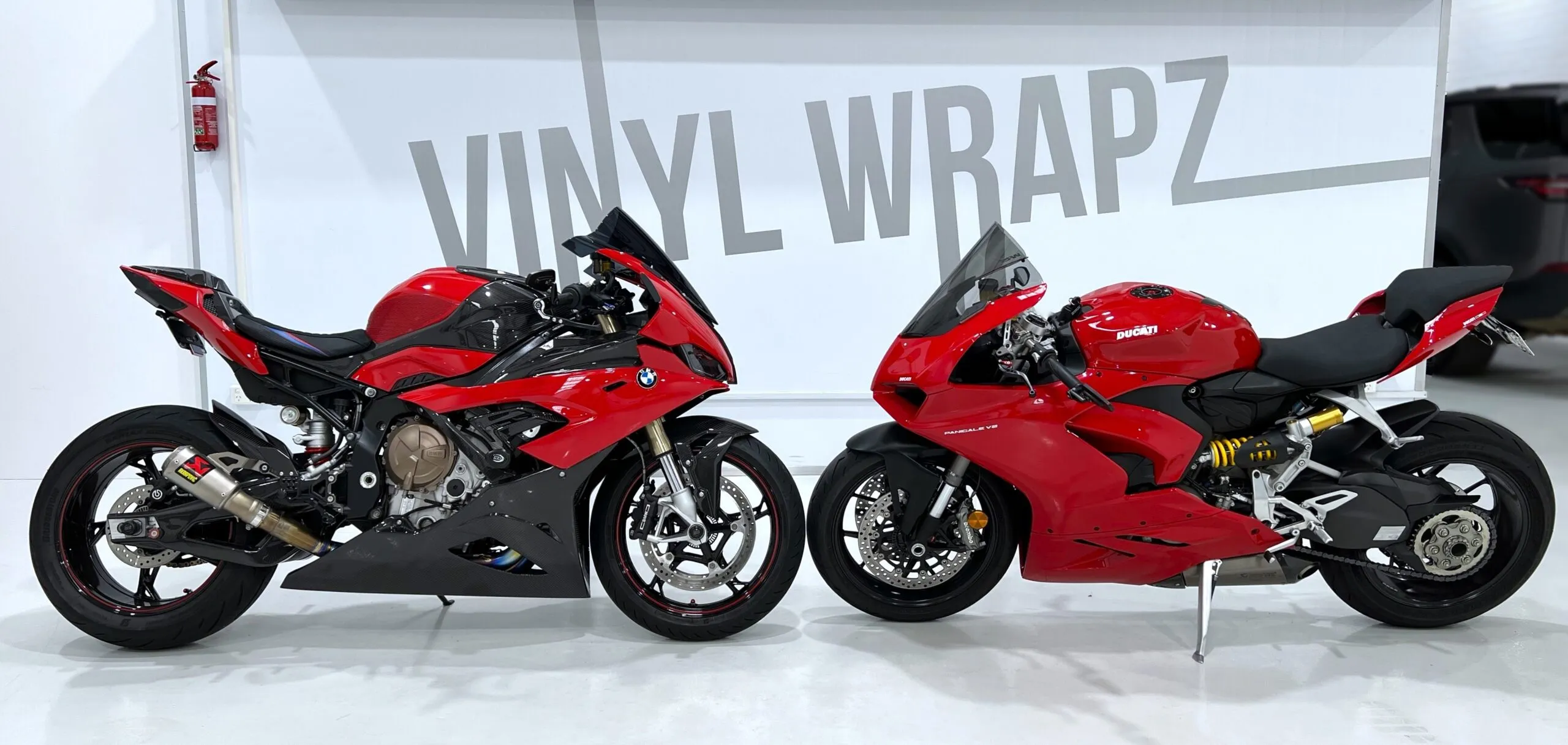 Ducati Panigale and BMW S1000RR in the Vinyl Wrapz workshop for paint protection film