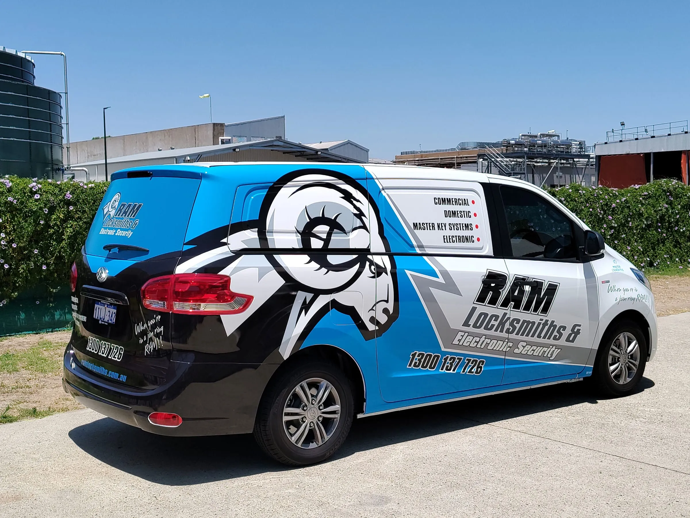 Installer wrapping a security company van