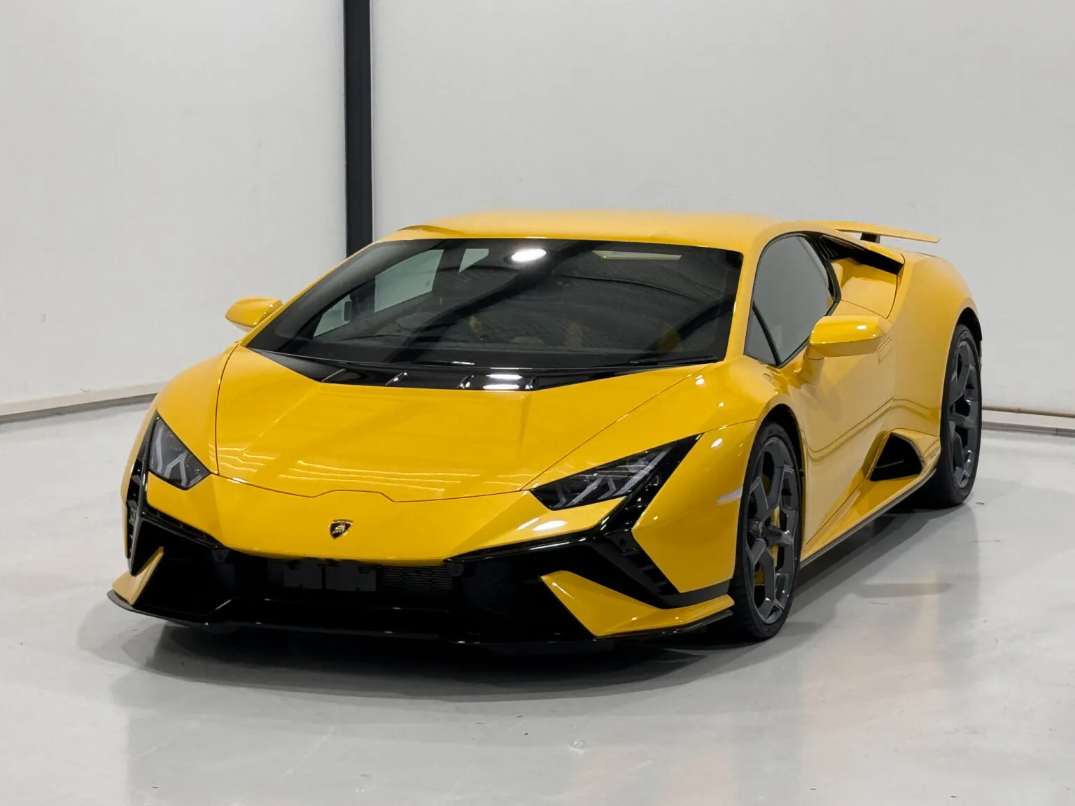 Yellow Lamborghini Huracán receiving paint protection film